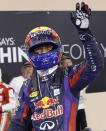 Red Bull Formula One driver Mark Webber of Australia waves after taking pole position during the qualifying session of the Abu Dhabi F1 Grand Prix at the Yas Marina circuit on Yas Island, November 2, 2013. Webber put Red Bull on pole position for the floodlit Abu Dhabi Formula One Grand Prix on Saturday in a front row sweep with quadruple world champion team mate Sebastian Vettel. REUTERS/Caren Firouz (UNITED ARAB EMIRATES - Tags: SPORT MOTORSPORT F1)