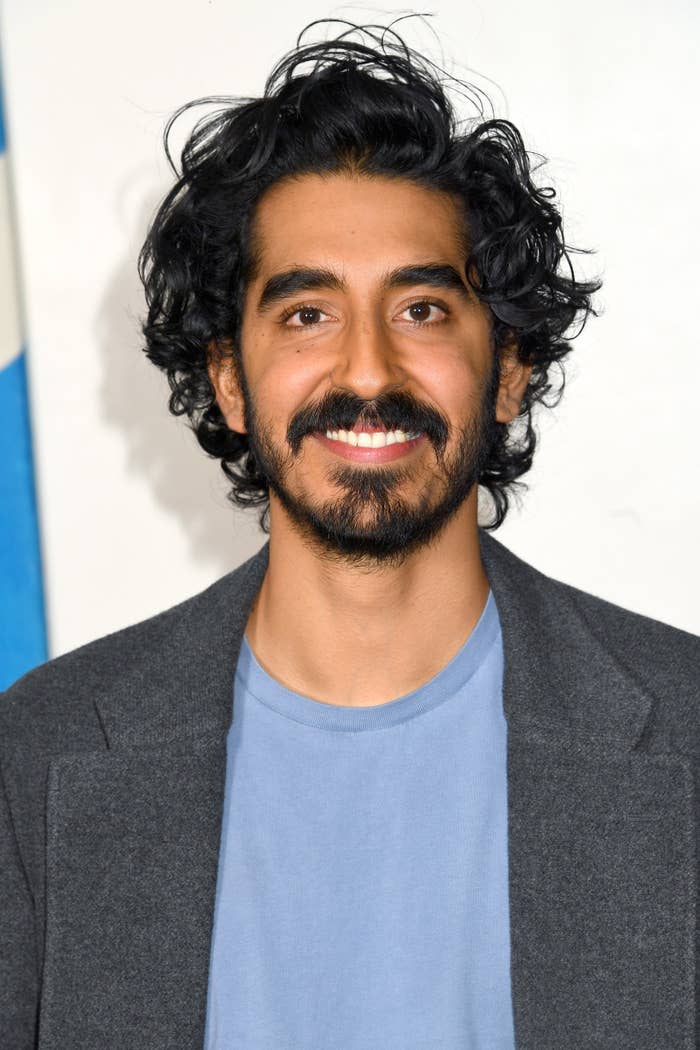 Dev Patel is pictured smiling at a movie screening in London in 2019