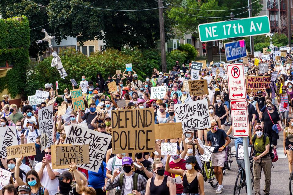 Demonstrators march against racism and police brutality and to defund th Minneapolis Police Department on June 6, 2020 in Minneapolis, Minnesota. - Demonstrations are being held across the US following the death of George Floyd on May 25, 2020, while being arrested in Minneapolis, Minnesota.