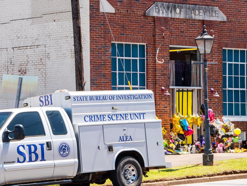 An SBI Crime Scene Unit vehicles is parked in front of the Fatal shootng scene in Dadeville, Ala., on Wednesday April 19, 2023. 