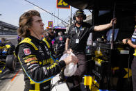 Colton Herta prepares to drives as his father Bryan Herta looks on during practice for the Indianapolis 500 auto race at Indianapolis Motor Speedway in Indianapolis, Friday, May 21, 2021. (AP Photo/Michael Conroy)