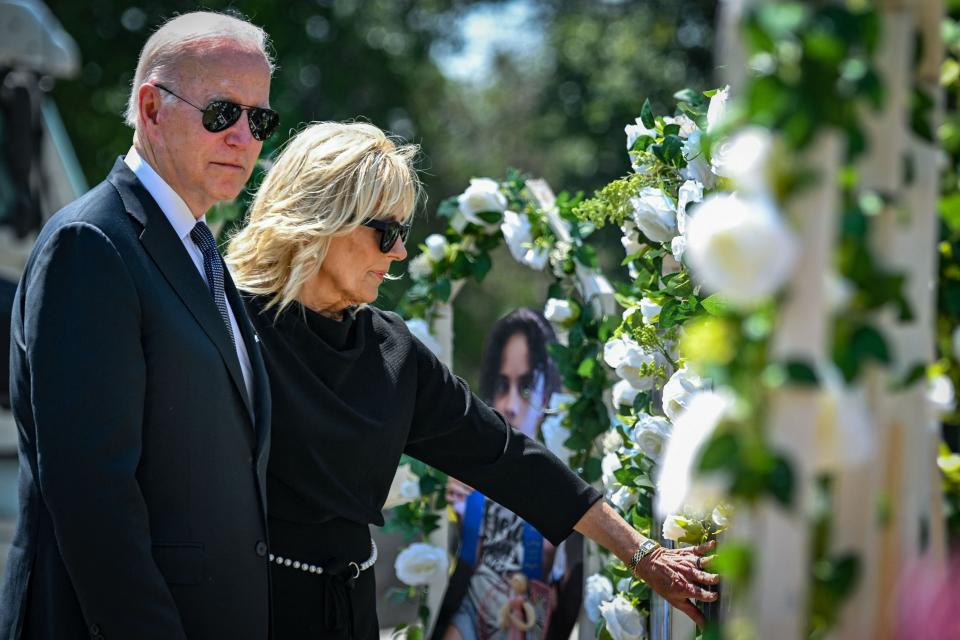 President Joe Biden and first lady Jill Biden pay their respects at a makeshift memorial outside of Robb Elementary School in Uvalde, Texas.