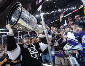 LOS ANGELES, CA - JUNE 11: Captain Dustin Brown #23 of the Los Angeles Kings holds up the Stanley Cup after the Kings defeated the New Jersey Devils 6-1 to win the Stanley Cup in Game Six of the 2012 Stanley Cup Final at Staples Center on June 11, 2012 in Los Angeles, California. (Photo by Bruce Bennett/Getty Images)