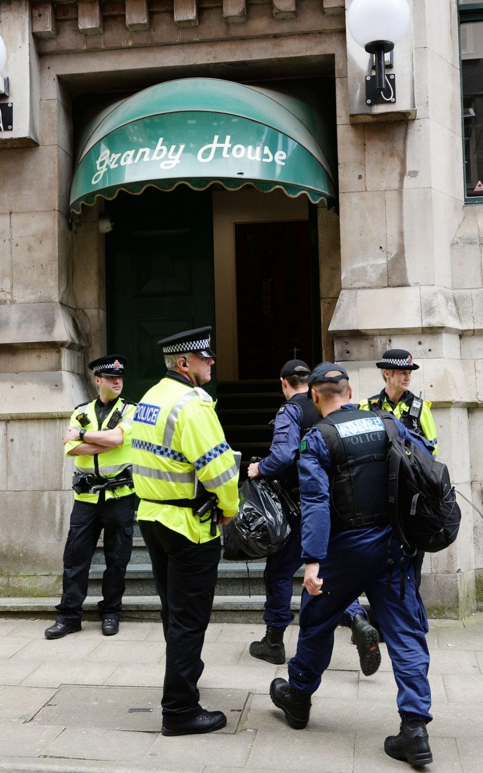 Police from the Tactical Aid Unit enter Granby House - Credit: Ben Birchall/PA