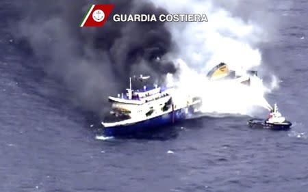 The car ferry Norman Atlantic burns in waters off Greece December 28, 2014 in this handout video grab of the Italian Coast Guard. REUTERS/Guardia Costiera/Handout via Reuters