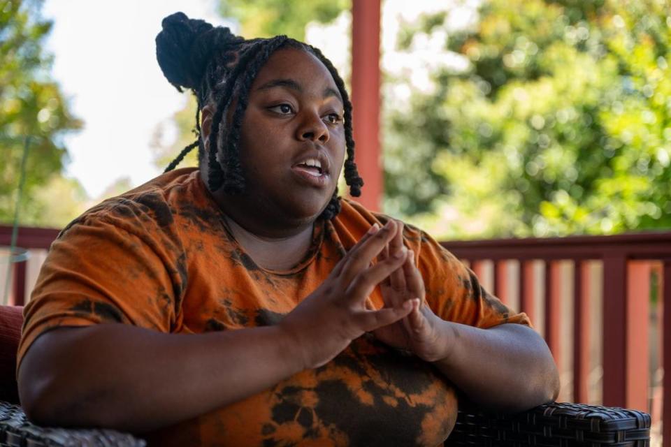 Arlysia Harris, 29, talks at home Tuesday about living with her parents. She said she wants to save enough money to not be a burden on them when she does move out. “It is an American culture thing they do teach us, you gotta be out by18, and you gotta be married by 18, and have kids before you are 21, and if you don’t they condemn you for it,” said Harris.