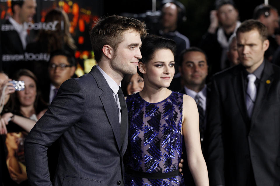 Cast members Robert Pattinson and Kristen Stewart pose at the premiere of 