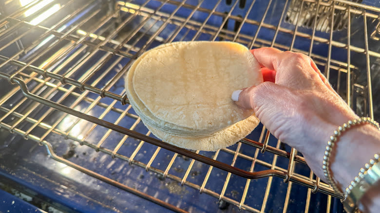 putting tortillas on oven rack