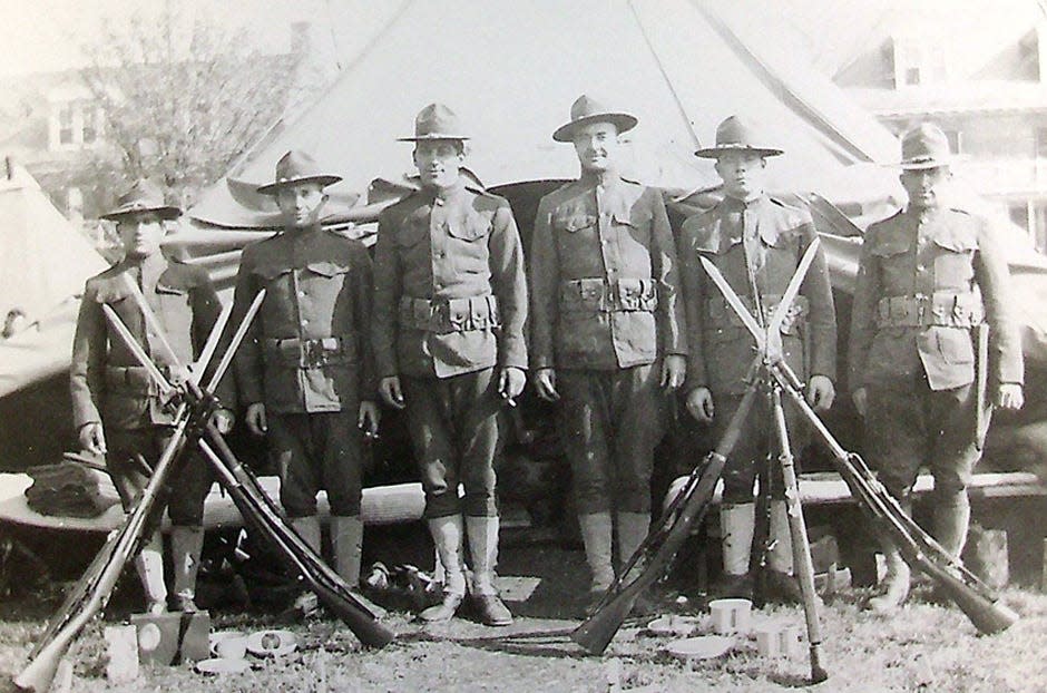 Cpl. Howard Claypoole stands with members of his unit during World War I.