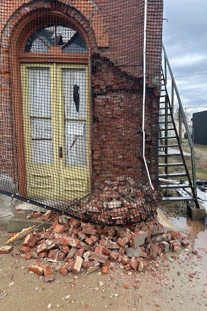 A pile of bricks gave way Thursday, indicating the former Tasty Nut Shop building in White Pigeon is starting to weaken.