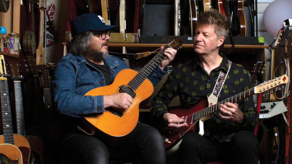  Tweedy strums his ’29 Martin 0-18 as Cline plays his Neptune 12-string. 