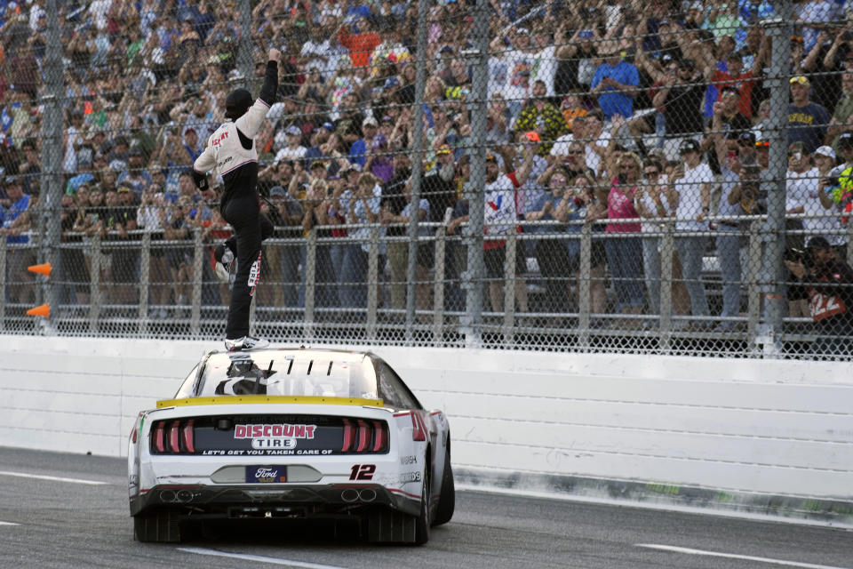 Ryan Blaney celebrates after winning a NASCAR Cup Series auto race at Martinsville Speedway in Martinsville, Va., Sunday, Oct. 29, 2023. (AP Photo/Chuck Burton)