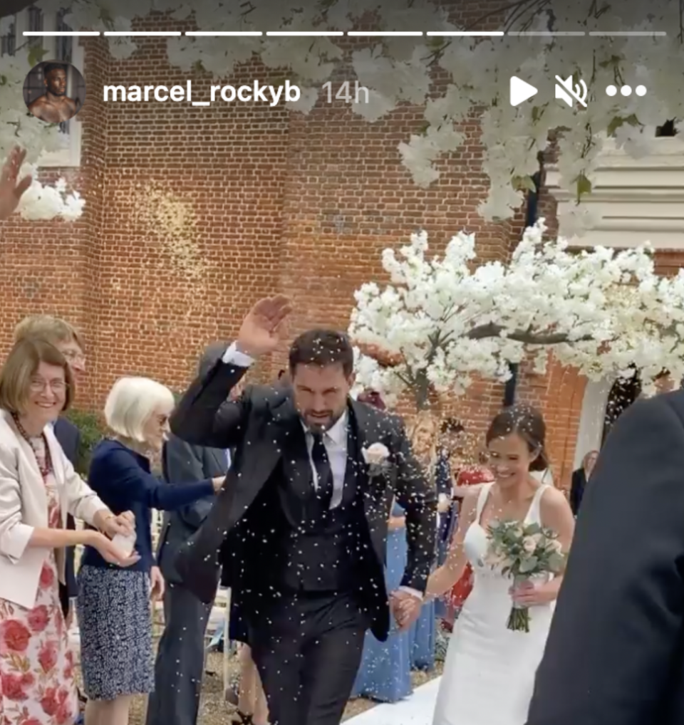 The happy couple are pelted with confetti (Instagram/marcel_rockyb)