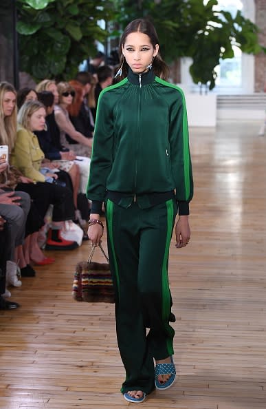 <p>A model in a green tracksuit walks the runway for the Valentino Resort 2018 runway show in New York City. (Photo: Getty Images) </p>