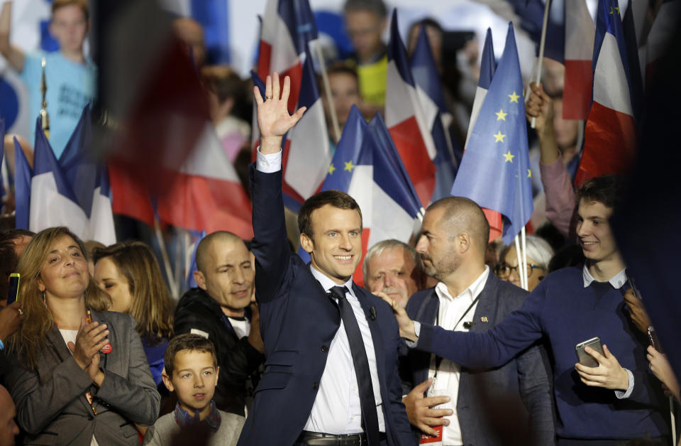 Independent centrist presidential candidate Emmanuel Macron gestures at the end of a campaign meeting in Marseille, southern France, Saturday, April, 1, 2017. The two-round presidential election is set for April 23 and May 7. (AP Photo/Claude Paris)