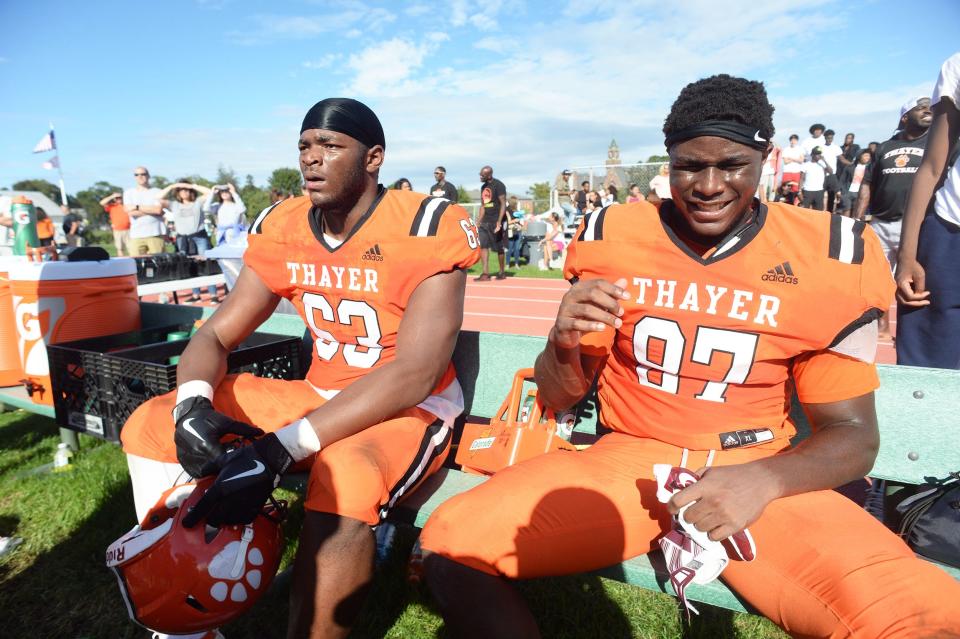 Fromleft, Thayer linemen Samson Okunlola (Brockton),  and brother Samuel Okunlola, right, during a game versus  St. Mark's on Saturday, Sept. 25, 2021.