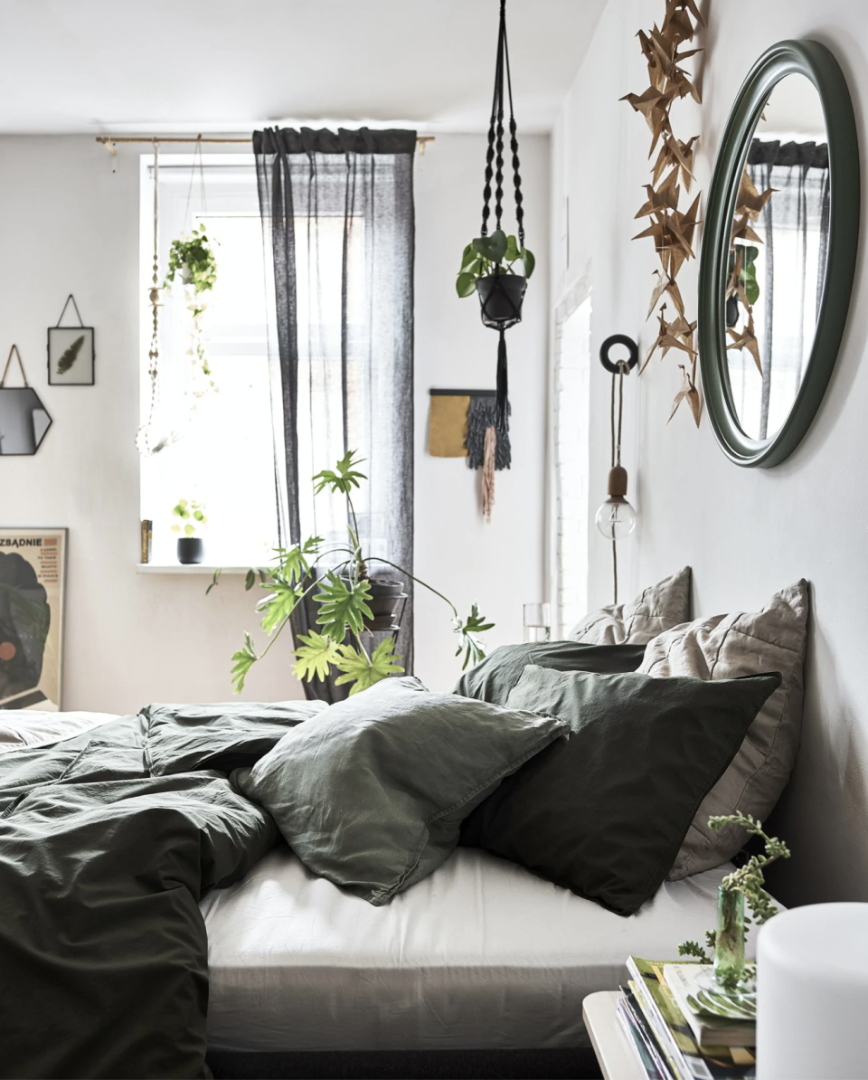 Add plenty of house plants for an easy bedroom update