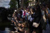 Hundreds of thousands of people lined canals in the Dutch capital to watch the colorful spectacle of the Pride Canal Parade return for the 25th edition after the last two events were canceled due to the COVID-19 pandemic, in Amsterdam, Netherlands, Saturday, Aug. 6, 2022. (AP Photo/Peter Dejong)