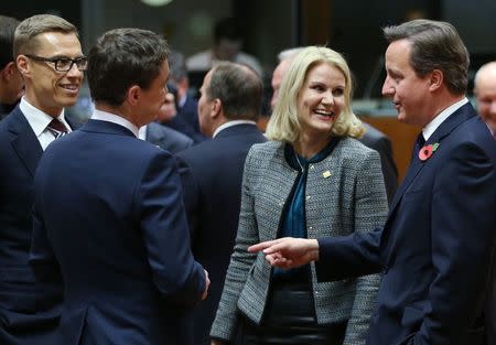 (L-R) Finland's Prime Minister Alexander Stubb, Estonia's Prime Minister Taavi Roivas, Denmark's Prime Minister Helle Thorning Schmidt and Britain's Prime Minister David Cameron attend an European Union leaders summit in Brussels October 23, 2014. REUTERS/Francois Lenoir