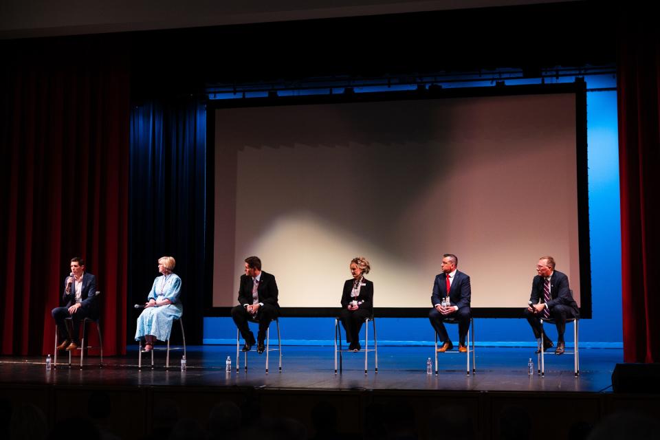 Candidates sit during the first Congressional District 2 debate at Woods Cross High School in Woods Cross on June 20, 2023. | Ryan Sun, Deseret News