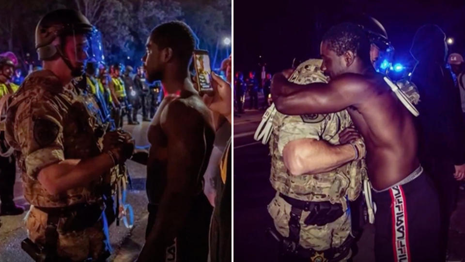 Black protestor Mark Karluah and white police officer David Cate embrace during a protest over George Floyd's death.