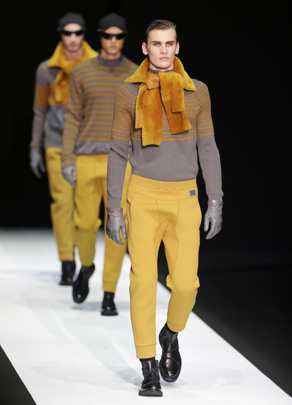 A model wears a creation for Emporio Armani men's Fall-Winter 2013-14 collection, part of the Milan Fashion Week, unveiled in Milan, Italy, Monday, Jan. 14, 2013. (AP Photo/Antonio Calanni)