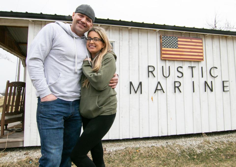 AJ Rowe, left, and his wife Lindsay, shown Wednesday, March 23, 2022, operate Rustic Marine from their Deerfield Township home.