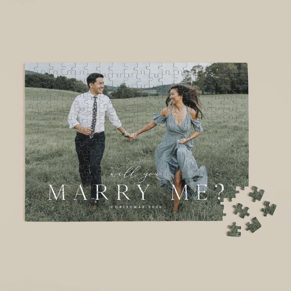 This image released by Minted shows a personalized puzzle. There are square and heart-shaped layouts, and you can pick black & white or color reproductions. It’s a nice way to celebrate family moments. (Minted via AP)