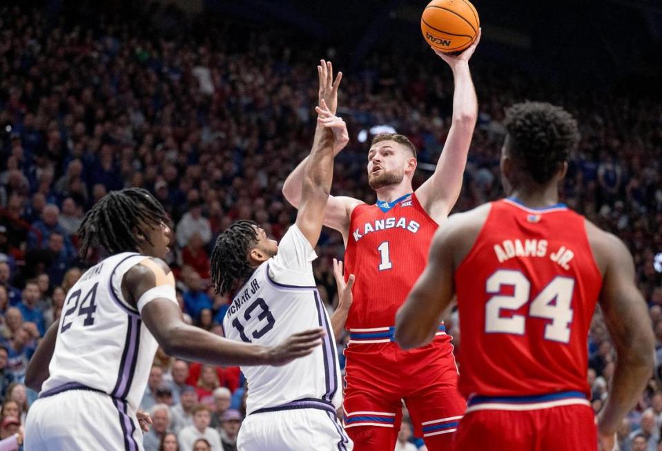 Kansas Jayhawks center Hunter Dickinson (1) shoots over Kansas State Wildcats forward Will McNair Jr. (13) during an NCAA college basketball game on Tuesday, March 5, 2024, in Lawrence.