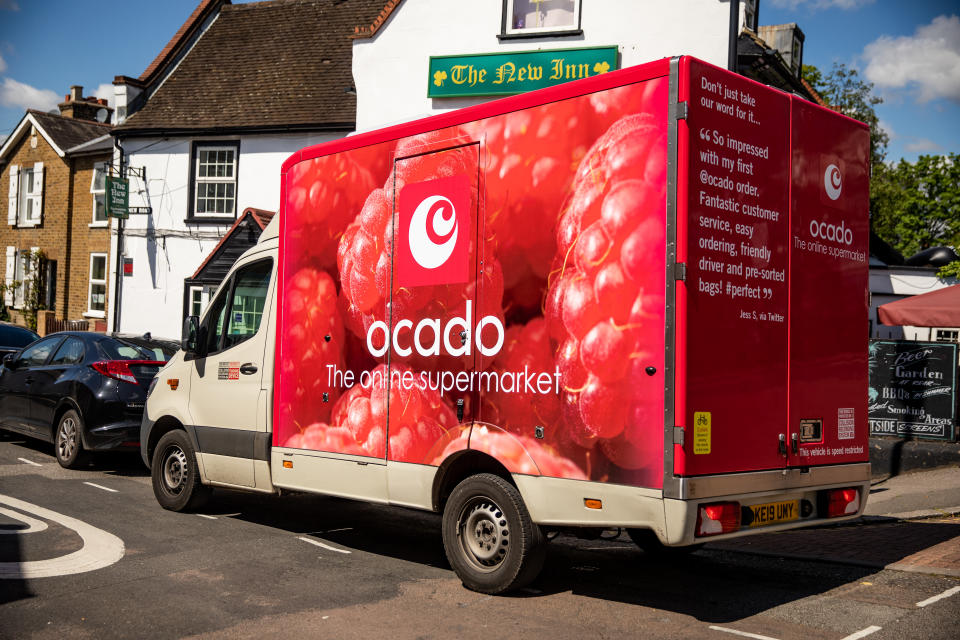 A Ocado delivery driver after dropping off food shopping outside a customer home during the Covid 19 pandemic.