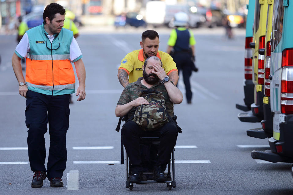 An injured passenger is taken away