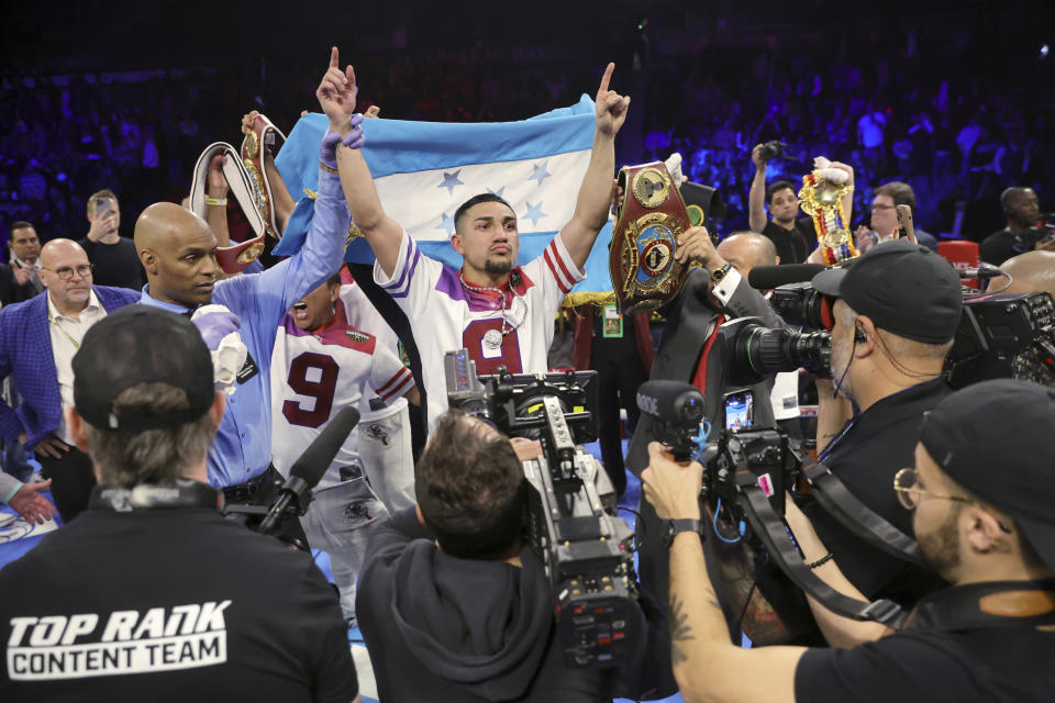 WBO junior welterweight champion Teofimo Lopez celebrates as he is named the winner over Jamaine Ortiz in their boxing bout Thursday, Feb. 8, 2024, in Las Vegas. Lopez retained his title with a unanimous decision. (Steve Marcus/Las Vegas Sun via AP)