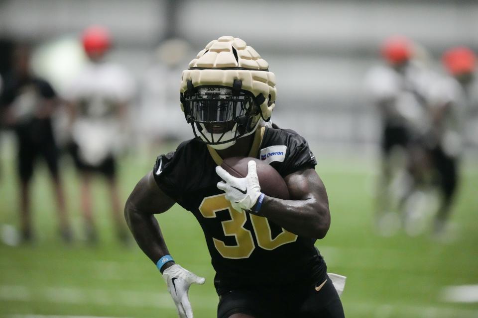 New Orleans Saints running back Jamaal Williams runs through drills during practice in Metairie, La., Tuesday, May 30, 2023. | Gerald Herbert, Associated Press