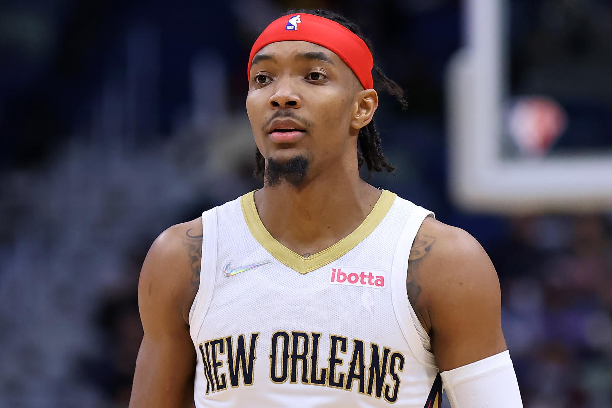 NEW ORLEANS, LOUISIANA - FEBRUARY 08: Devonte' Graham #4 of the New Orleans Pelicans reacts against the Houston Rockets during a game at the Smoothie King Center on February 08, 2022 in New Orleans, Louisiana. NOTE TO USER: User expressly acknowledges and agrees that, by downloading and or using this Photograph, user is consenting to the terms and conditions of the Getty Images License Agreement. (Photo by Jonathan Bachman/Getty Images)