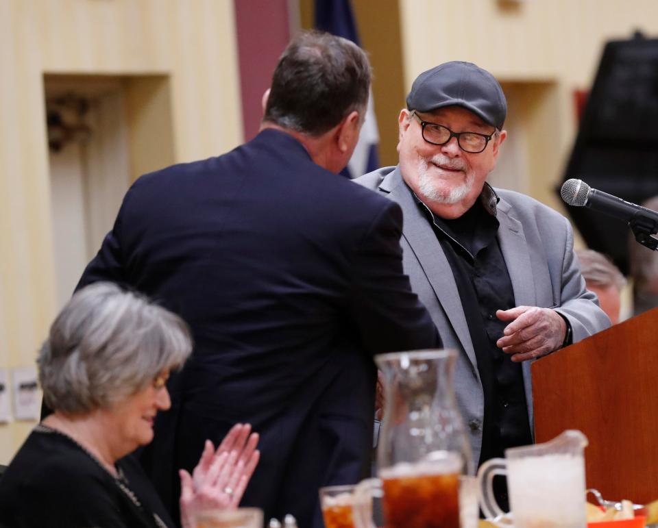 Danny Koch shakes hands with Don Caldwell after Caldwell spoke at an event on Wednesday, April 26, 2023. Lubbock County Adult Drug and DWI Court held a special event at the MCM Elegante Hotel to publicize their efforts and to raise money to save lives by honoring Koch on his 70th birthday.