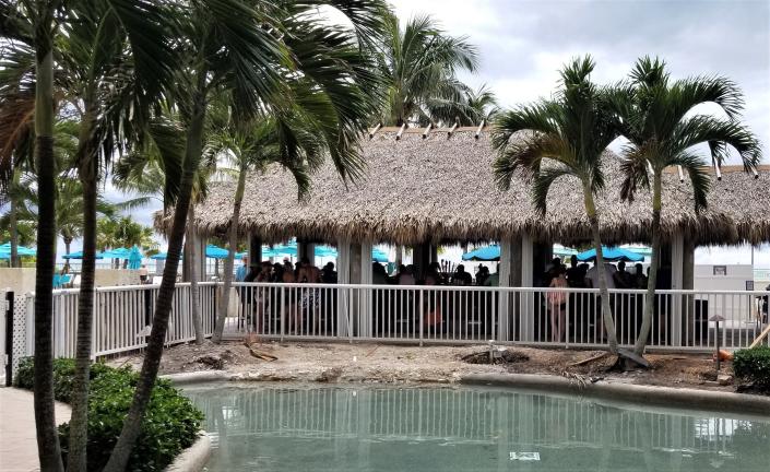 Lido Beach Resort Tiki Bar is next to a shallow lagoon and a large swimming pool (not pictured) overlooking the beach on Sarasota's Lido Key.