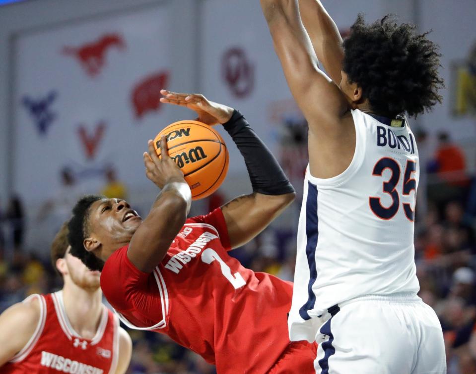 Wisconsin guard AJ Storr falls back attempting to drive to the hoop. The University of Wisconsin Badgers mens basketball team defeated the University of Virginia Cavaliers as they faced off in the 2023 Fort Myers Tip-Off tournament Monday, November 20, 2023. The Badgers won with a final score of 65-41.