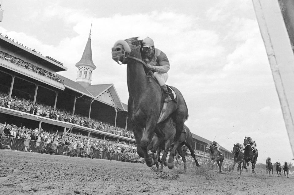 FILE - In this May 4, 1968, file photo, Dancer's Image, jockey Bob Ussery up, crosses the finish line to win the 94th running of the Kentucky Derby at Churchill Downs in Louisville, Ky. America’s longest continuously held sporting event turns 150 years old Saturday. The Kentucky Derby has survived two world wars, the Depression and pandemics, including COVID-19 in 2020, when it ran in virtual silence without the usual crowd of 150,000. (AP Photo/File)