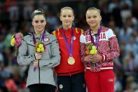 <p>Silver medallist McKayla Maroney Maroney (L) of the United States, gold medallist Sandra Raluca Izbasa of Romania and bronze medallist Maria Paseka of Russia pose with their medals during the medal ceremony following the Artistic Gymnastics Women’s Vault final on Day 9 of the London 2012 Olympic Games at North Greenwich Arena on August 5, 2012 in London, England. (Photo by Ronald Martinez/Getty Images) </p>