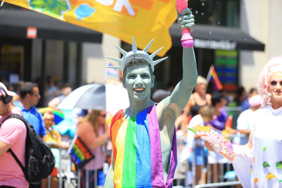 A marcher dressed as a the Statue of Liberty gestures for the camera during the N.Y.C. Pride Parade in New York on June 30, 2019. (Photo: Gordon Donovan/Yahoo News)