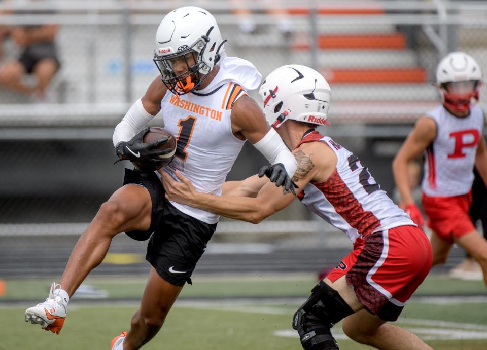 Washington and Pekin players face off during the annual 7-on-7 football camp Saturday, July 20, 2024 hosted by Washington Community High School.