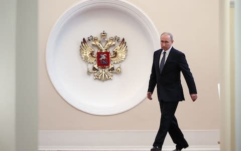 The president walks to the hall where guests were awaiting the ceremony - Credit: Sergei Bobylyov/AFP/Getty Images