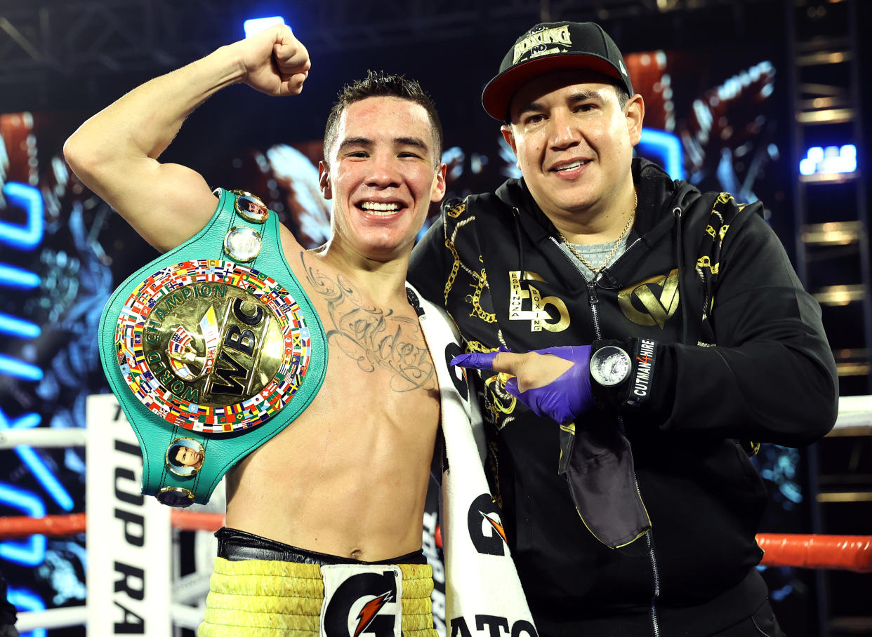 LAS VEGAS, NV - FEBRUARY 20: Oscar Valdez and Trainer Eddy Reynoso after the victory over Miguel Berchelt for the WBC super featherweight title at the MGM Grand Conference Center on February 20, 2021 in Las Vegas, Nevada. (Photo by Mikey Williams/Top Rank Inc via Getty Images)