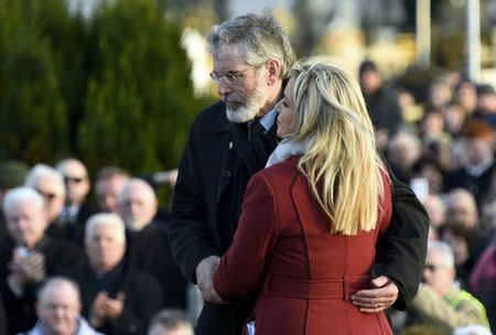 Sinn Fein's Michelle O'Neill and Gerry Adams join mourners at Martin McGuinness's funeral in Londonderry, Northern Ireland, March 23, 2017. REUTERS/Clodagh Kilcoyne
