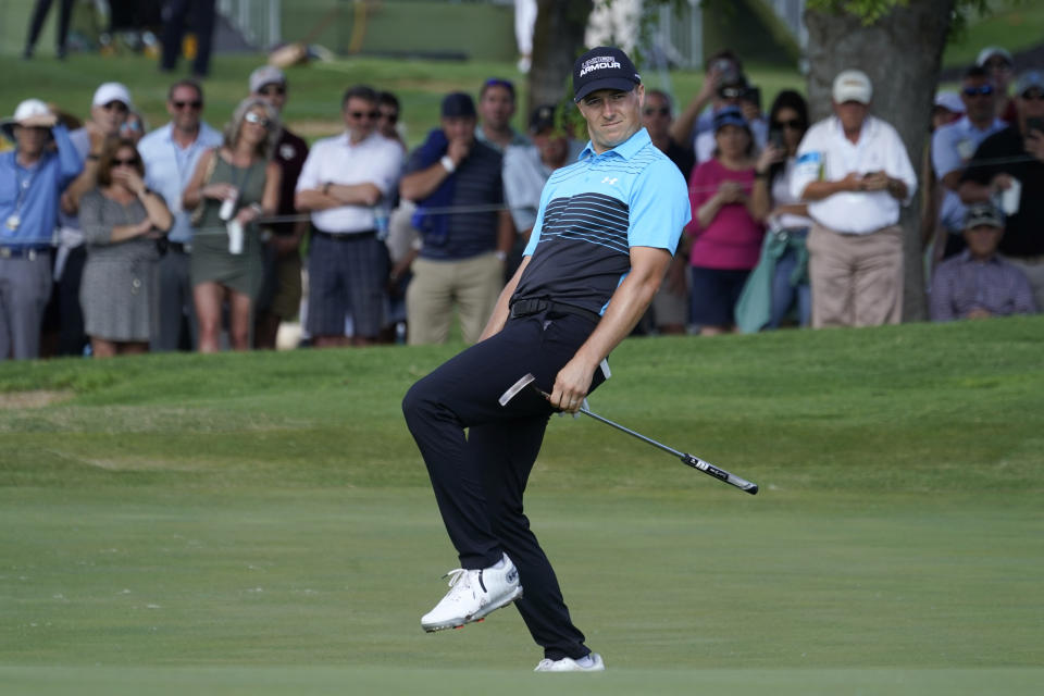 Jordan Spieth reacts as he makes an eagle putt on the 18th green during the first round of the AT&T Byron Nelson golf tournament, Thursday, May 13, 2021, in McKinney, Texas. (AP Photo/Tony Gutierrez)