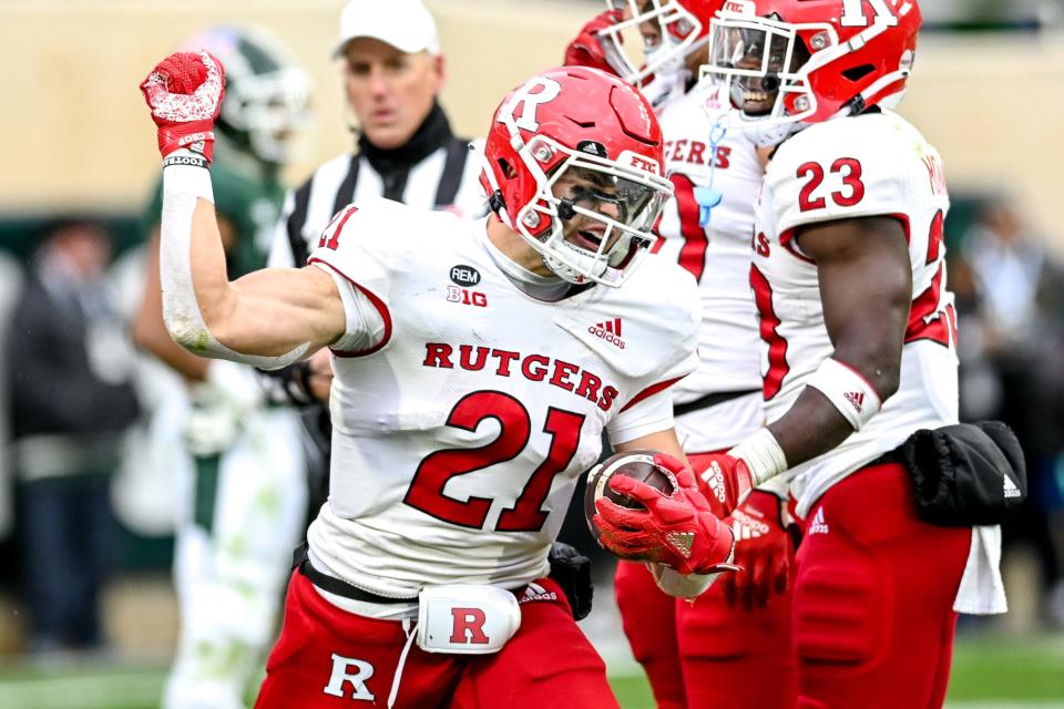 Rutgers' Johnny Langan celebrates his touchdown against Michigan State during the third quarter on Saturday, Nov. 12, 2022, in East Lansing.