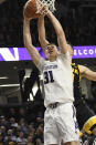 Northwestern forward Robbie Beran (31) has his shot blocked by Iowa guard Joe Wieskamp during the second half of an NCAA college basketball game Tuesday, Jan. 14, 2020, in Evanston, Ill. (AP Photo/David Banks)