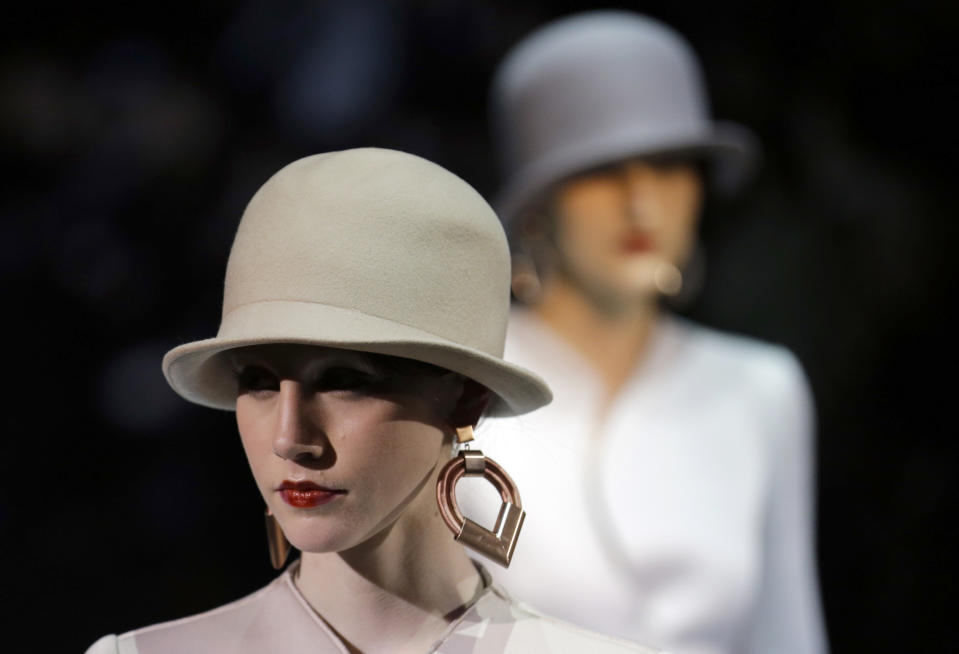 Models wear creations for Emporio Armani women's Fall-Winter 2013-14 collection, part of the Milan Fashion Week, unveiled in Milan, Italy, Sunday, Feb. 24, 2013. (AP Photo/Luca Bruno)