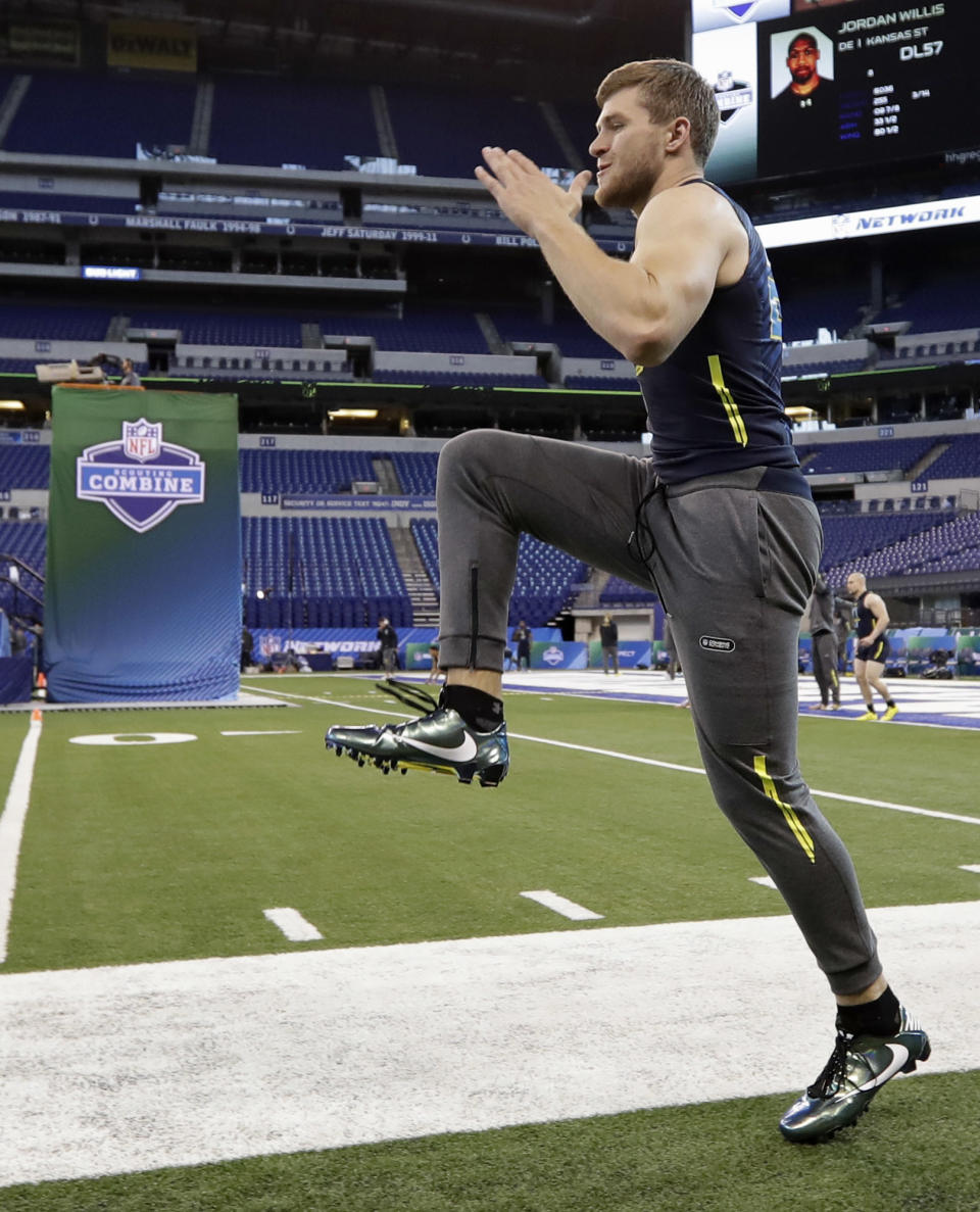 Wisconsin linebacker T.J. Watt stretches at the NFL football scouting combine Sunday, March 5, 2017, in Indianapolis. (AP Photo/David J. Phillip)