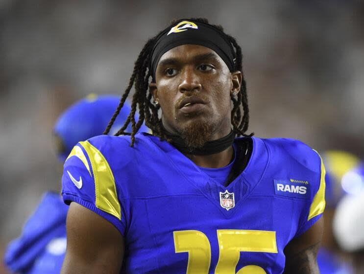 Los Angeles Rams wide receiver Demarcus Robinson (15) looks on from the bench during an NFL football game against the Cincinnati Bengals on Monday, Sept. 25, 2023, in Cincinnati. (AP Photo/Emilee Chinn)